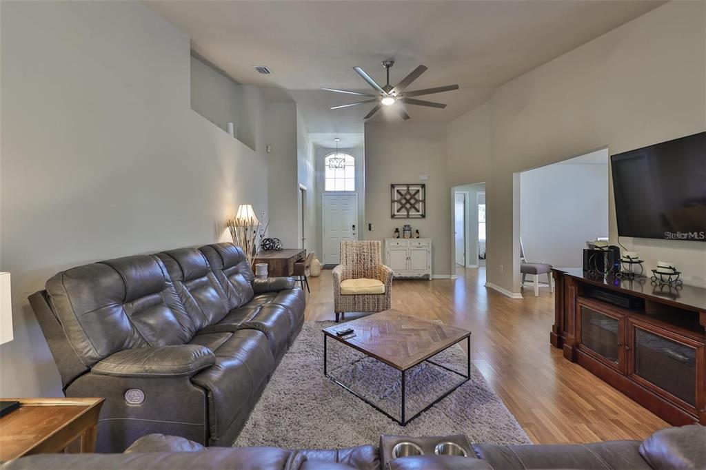 128 Lookout Drive Apollo Beach, FL 33572 - Photo 5 of 36 a living room with furniture and a flat screen tv