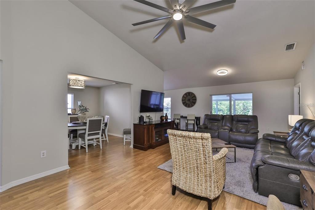 128 Lookout Drive Apollo Beach, FL 33572 - Photo 6 of 36 a living room with furniture and a wooden floor