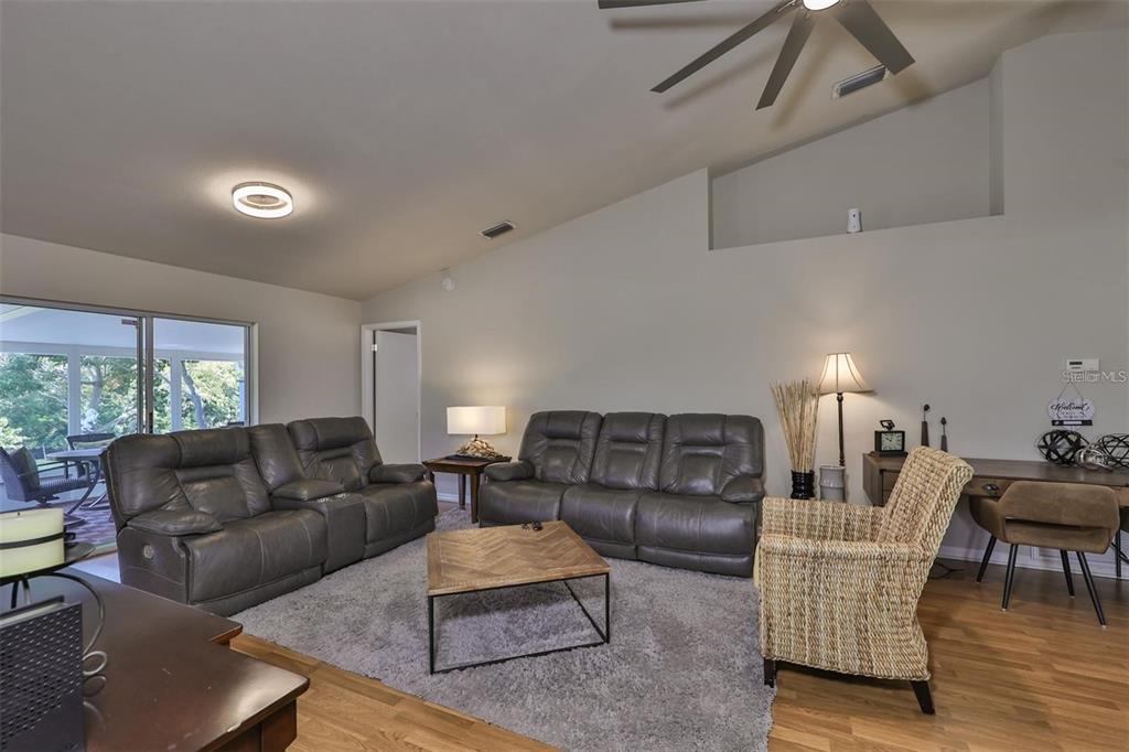 128 Lookout Drive Apollo Beach, FL 33572 - Photo 7 of 36 a living room with furniture and a large window