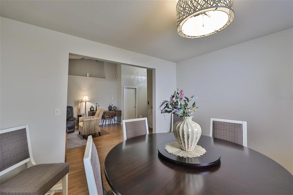 128 Lookout Drive Apollo Beach, FL 33572 - Photo 9 of 36 a view of a dining room with furniture
