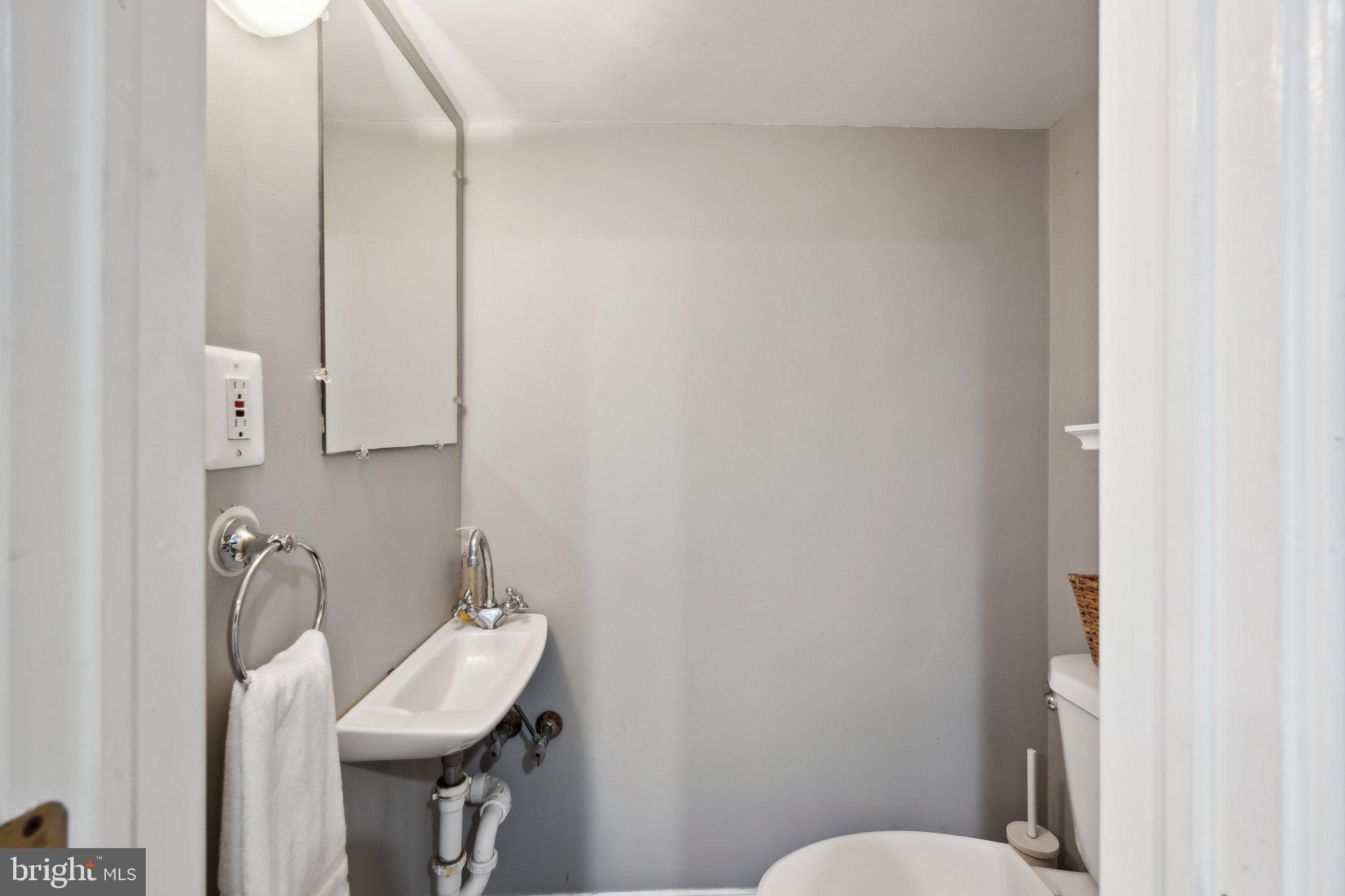 24 Fleet Street Annapolis, MD 21401 - Photo 12 of 32 a bathroom with a sink and toilet