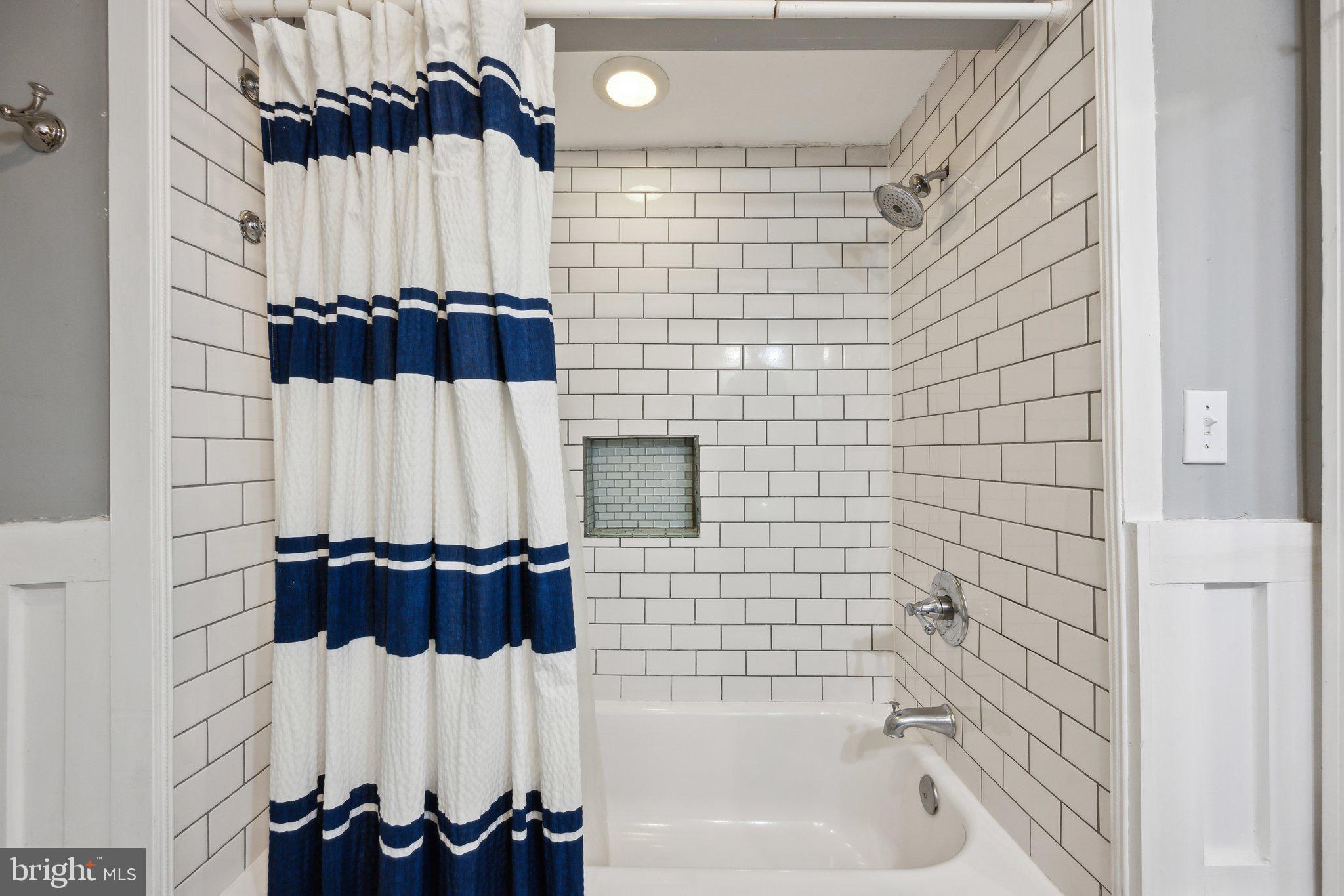 24 Fleet Street Annapolis, MD 21401 - Photo 17 of 32 a bathroom with a bathtub and shower