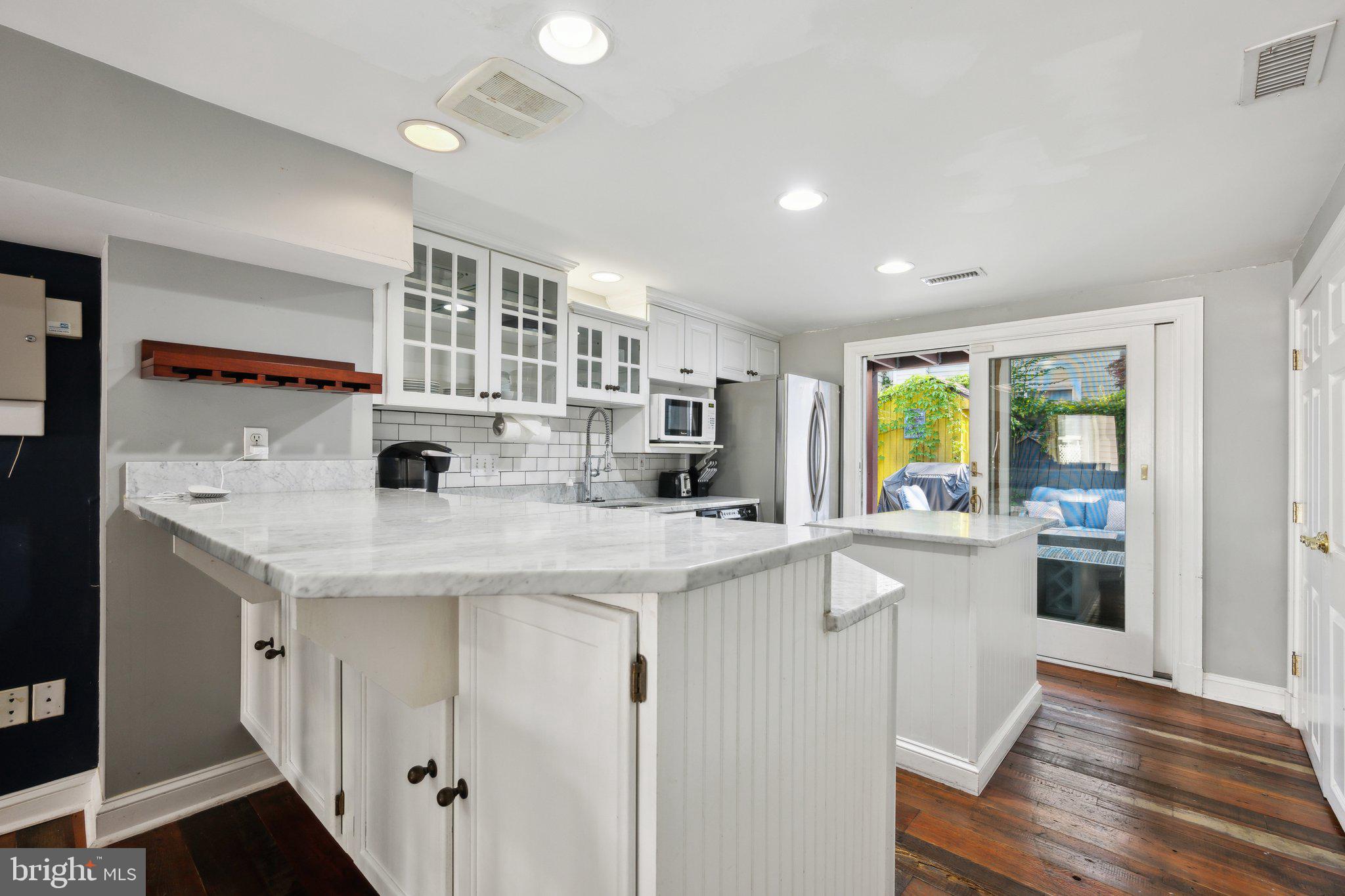 24 Fleet Street Annapolis, MD 21401 - Photo 7 of 32 a kitchen with stainless steel appliances granite countertop a sink and cabinets