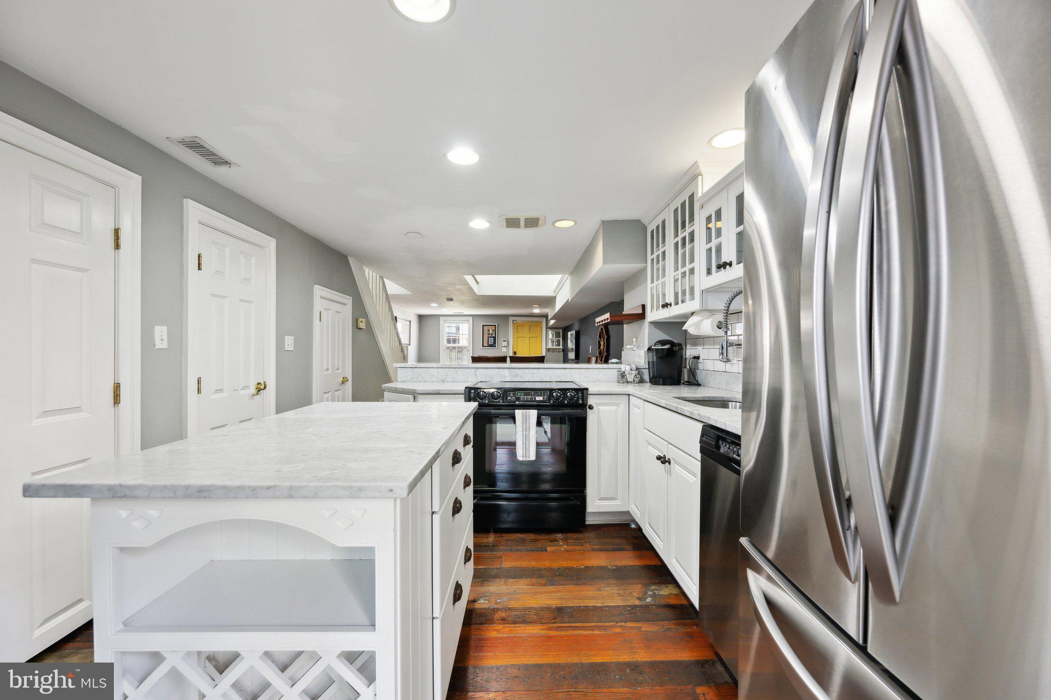 24 Fleet Street Annapolis, MD 21401 - Photo 10 of 32 a kitchen with stainless steel appliances granite countertop a refrigerator a stove and a sink