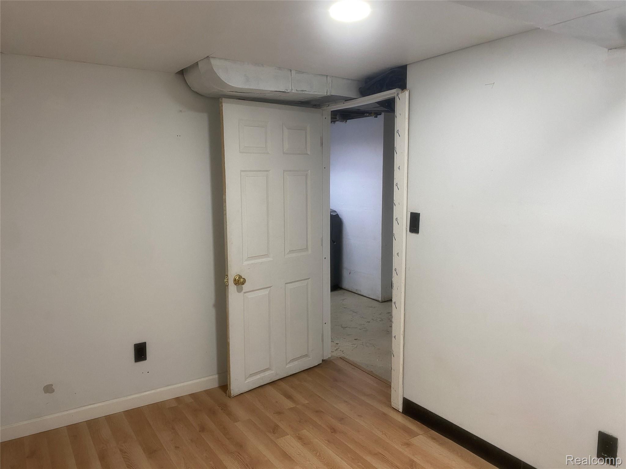 180 West Rutgers Avenue Pontiac, MI 48340 - Photo 31 of 33 Unfurnished room featuring light wood-type flooring and baseboards