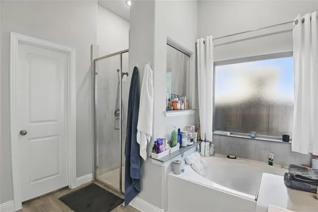 a bathroom with a tub and a sink