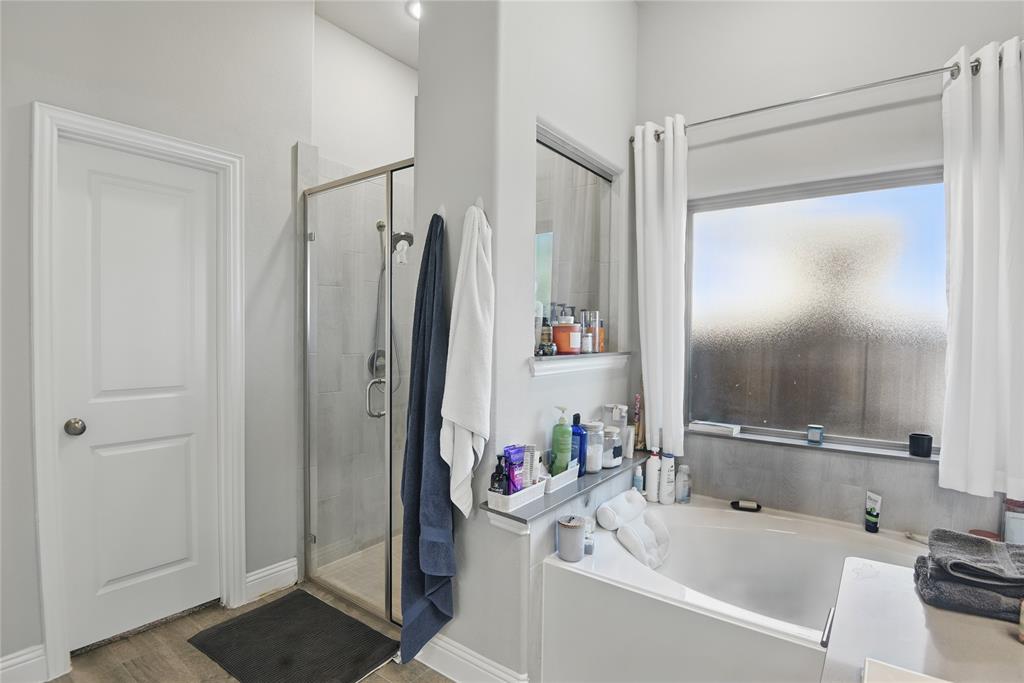 1164 Red Hawk Lane Forney, TX 75126 - Photo 15 of 27 a bathroom with a tub and a sink