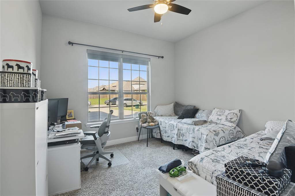 1164 Red Hawk Lane Forney, TX 75126 - Photo 16 of 27 a bedroom with furniture and a window