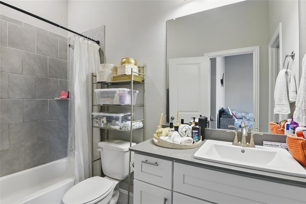 1164 Red Hawk Lane Forney, TX 75126 - Photo 17 of 27 a bathroom with a sink a toilet and shower