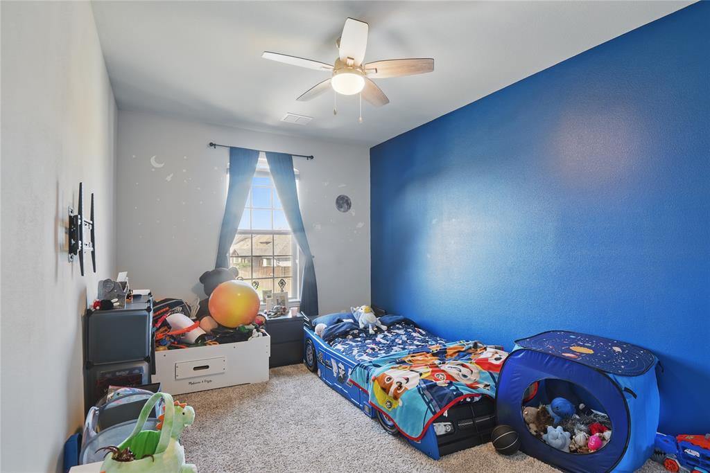 1164 Red Hawk Lane Forney, TX 75126 - Photo 25 of 27 a bedroom with bed and a window