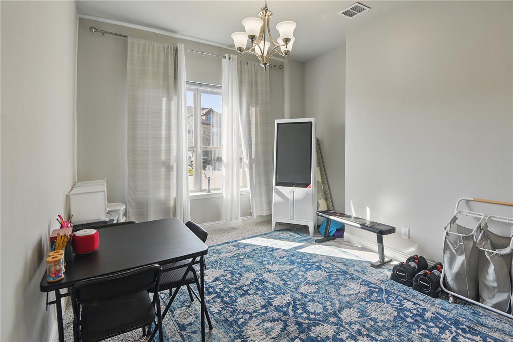 1164 Red Hawk Lane Forney, TX 75126 - Photo 4 of 27 a view of a room with gym equipment