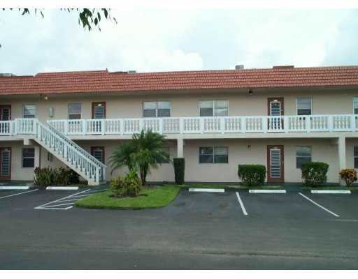 9338 Southwest 3rd Street, Unit 5150 Boca Raton, FL 33428 - Photo 1 of 1 a view of a building with a garden
