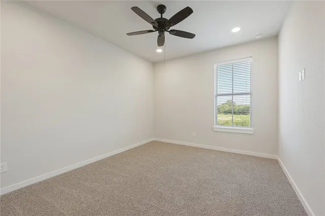 a kitchen with a sink cabinets and wooden floor