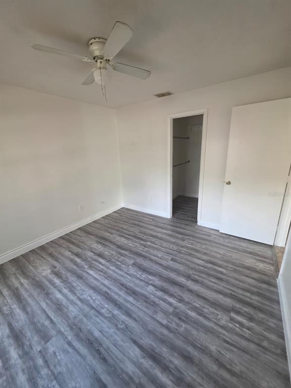 2358 Water View Loop Kissimmee, FL 34743 - Photo 12 of 26 wooden floor in an empty room