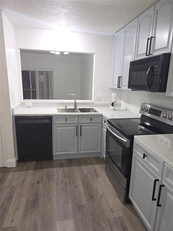 2358 Water View Loop Kissimmee, FL 34743 - Photo 23 of 26 a kitchen with a sink and cabinets