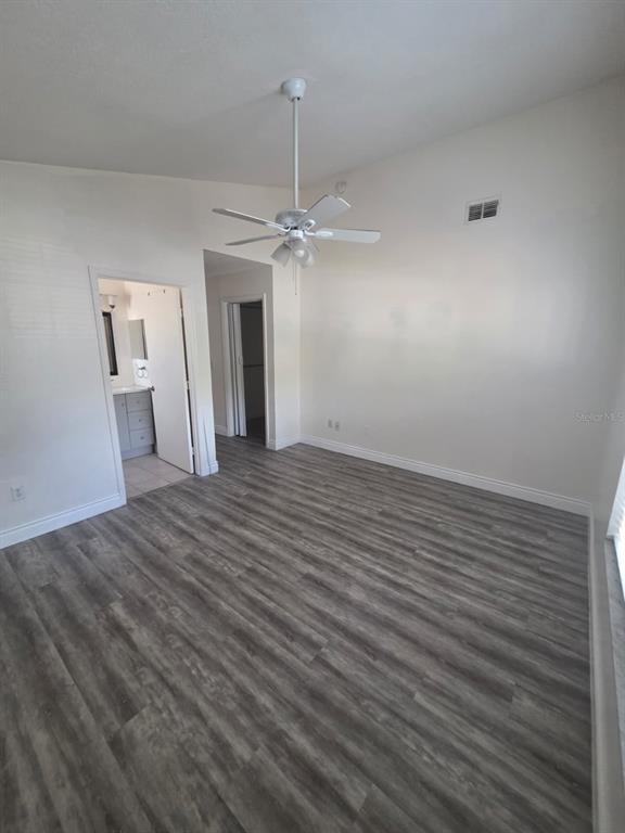 2358 Water View Loop Kissimmee, FL 34743 - Photo 8 of 26 wooden floor in an empty room