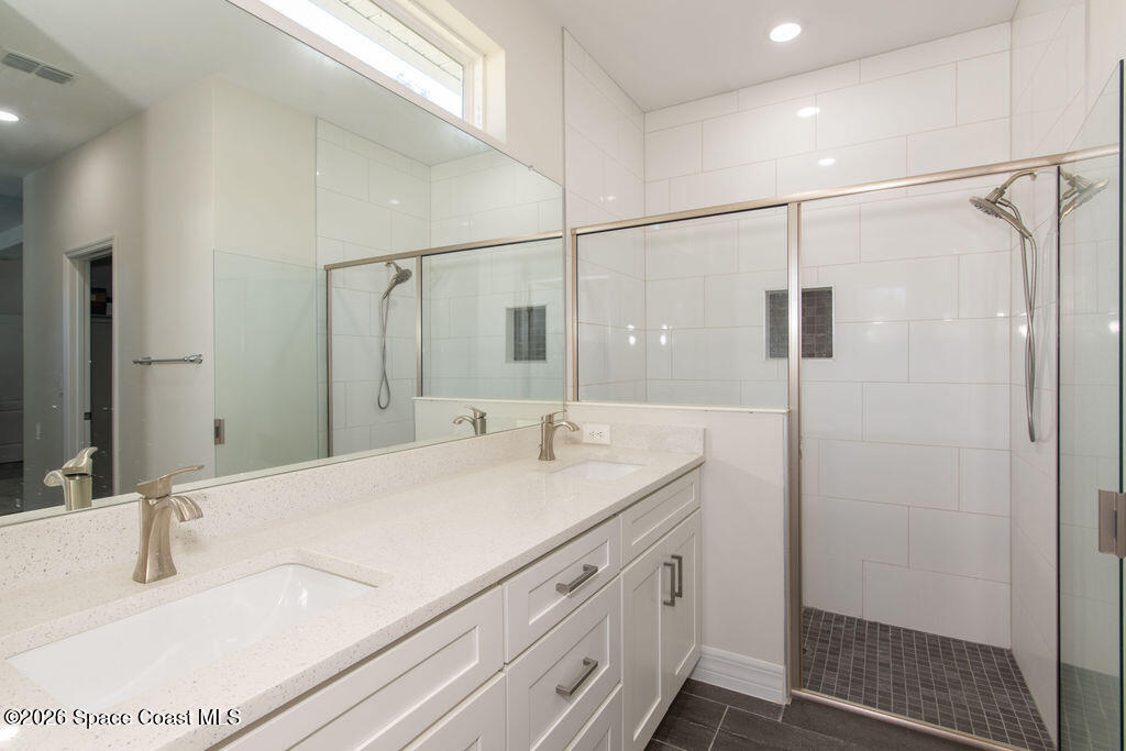 200 Triana Avenue Southwest Palm Bay, FL 32908 - Photo 11 of 27 a bathroom with a sink and a mirror
