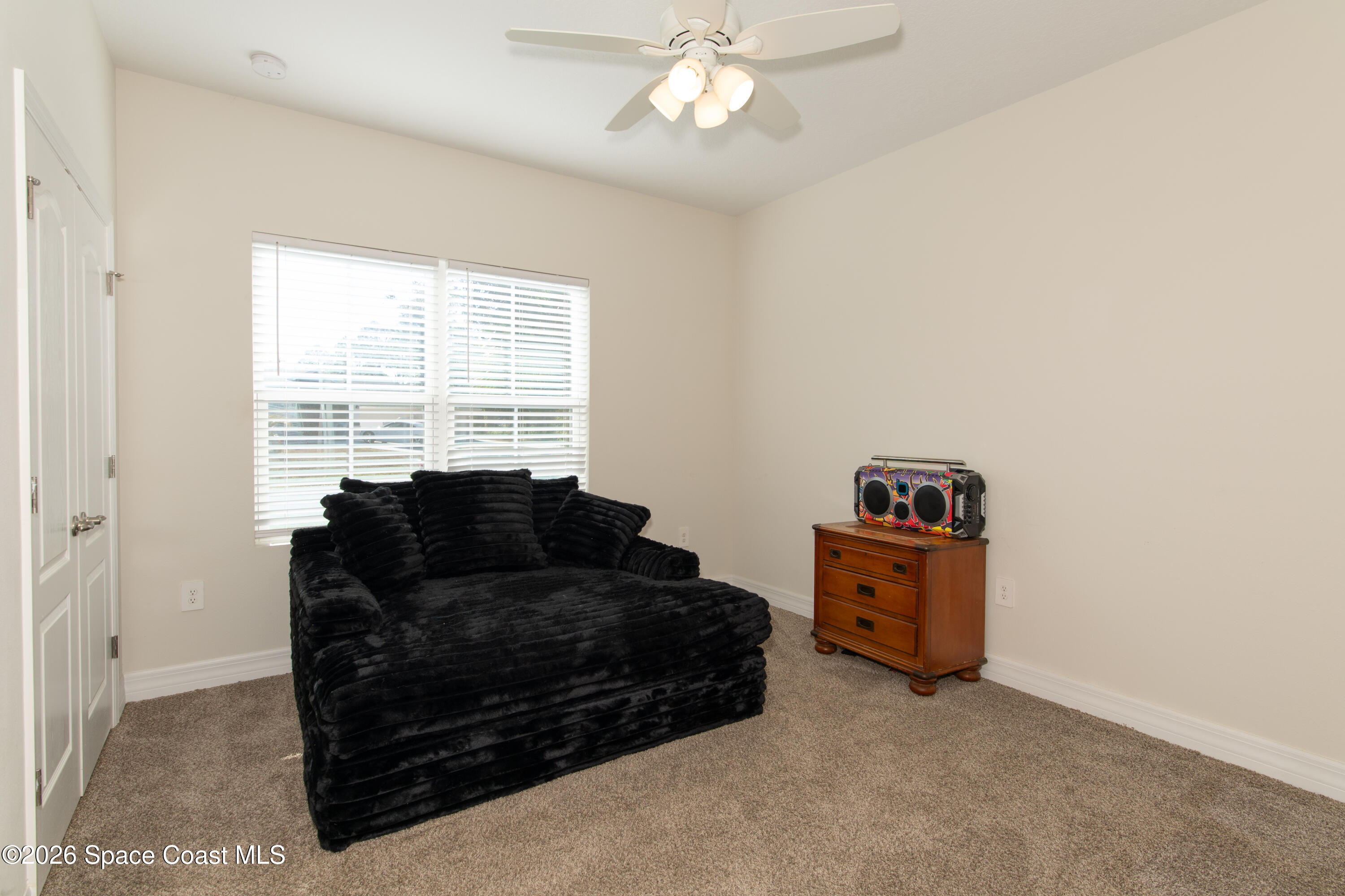 200 Triana Avenue Southwest Palm Bay, FL 32908 - Photo 12 of 27 a living room with furniture and a window