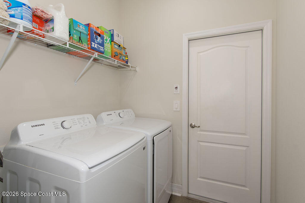 200 Triana Avenue Southwest Palm Bay, FL 32908 - Photo 17 of 27 a utility room with dryer and washer