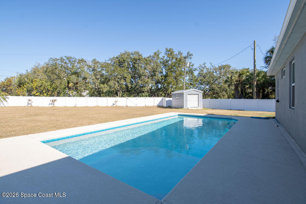 200 Triana Avenue Southwest Palm Bay, FL 32908 - Photo 19 of 27 a view of a swimming pool with an outdoor seating