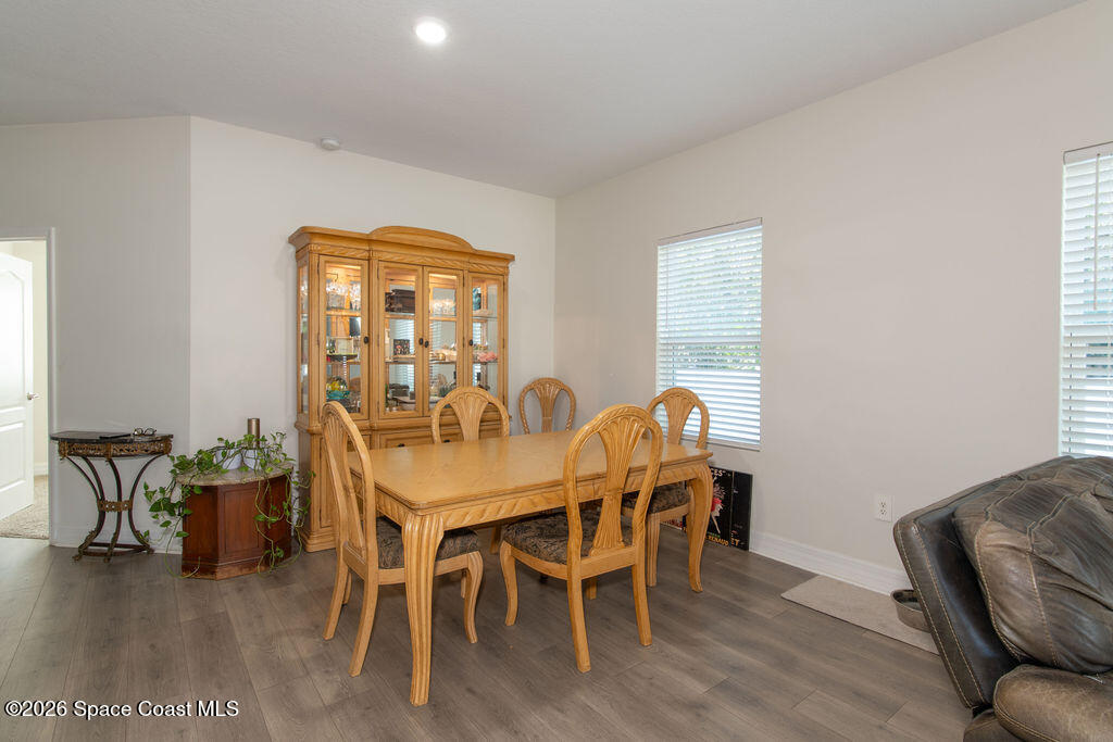 200 Triana Avenue Southwest Palm Bay, FL 32908 - Photo 7 of 27 a view of a dining room with furniture window and outside view