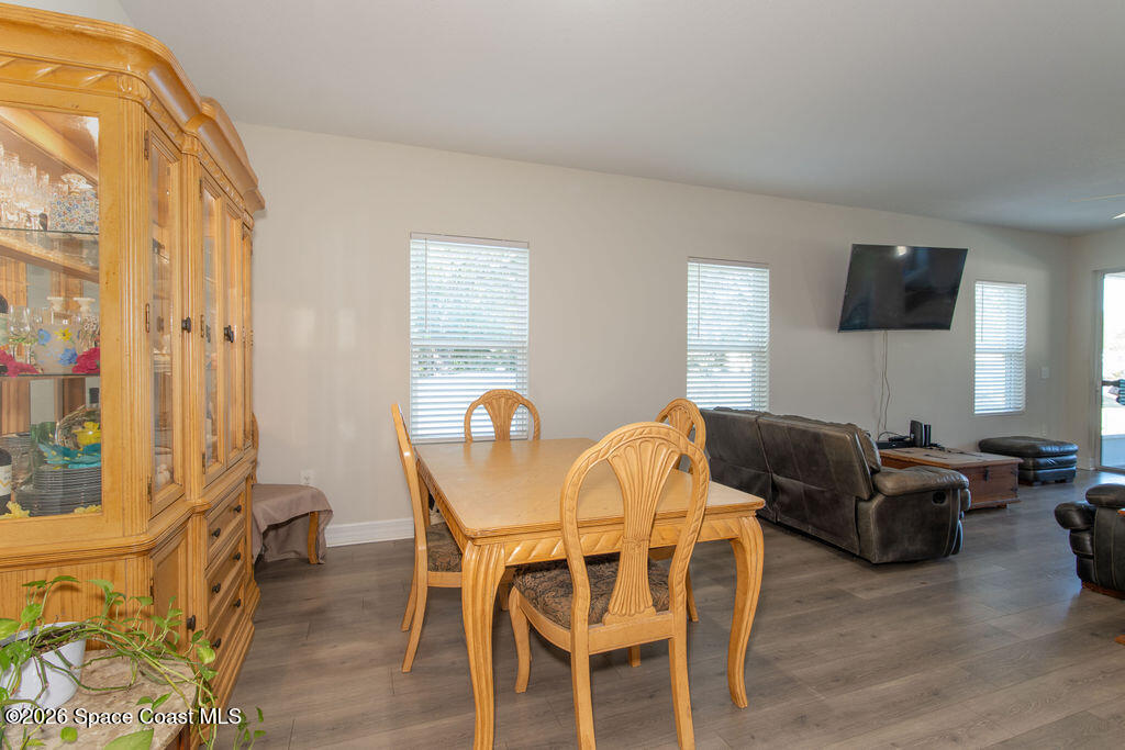 200 Triana Avenue Southwest Palm Bay, FL 32908 - Photo 8 of 27 a living room with furniture a flat screen tv and a window
