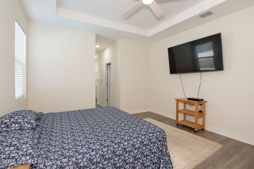200 Triana Avenue Southwest Palm Bay, FL 32908 - Photo 10 of 27 a bedroom with a bed and a flat screen tv