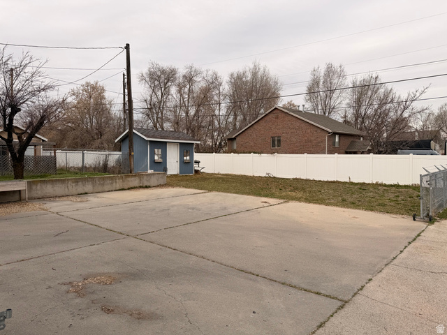 110 South 200 East Springville, UT 84663 - Photo 20 of 23 Fenced backyard with a storage shed