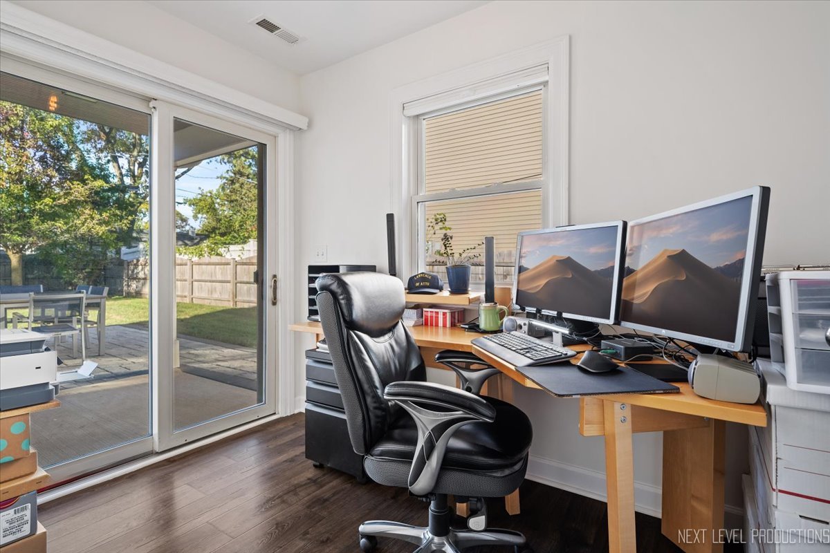 703 Wakeman Avenue Wheaton, IL 60187 - Photo 12 of 20 a view of a workspace with furniture and a window