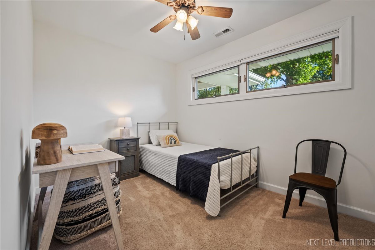703 Wakeman Avenue Wheaton, IL 60187 - Photo 15 of 20 a bedroom with furniture and a window