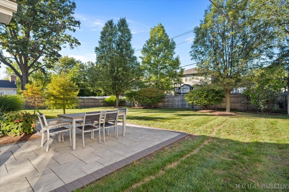 703 Wakeman Avenue Wheaton, IL 60187 - Photo 18 of 20 a view of a swimming pool with chairs and plants