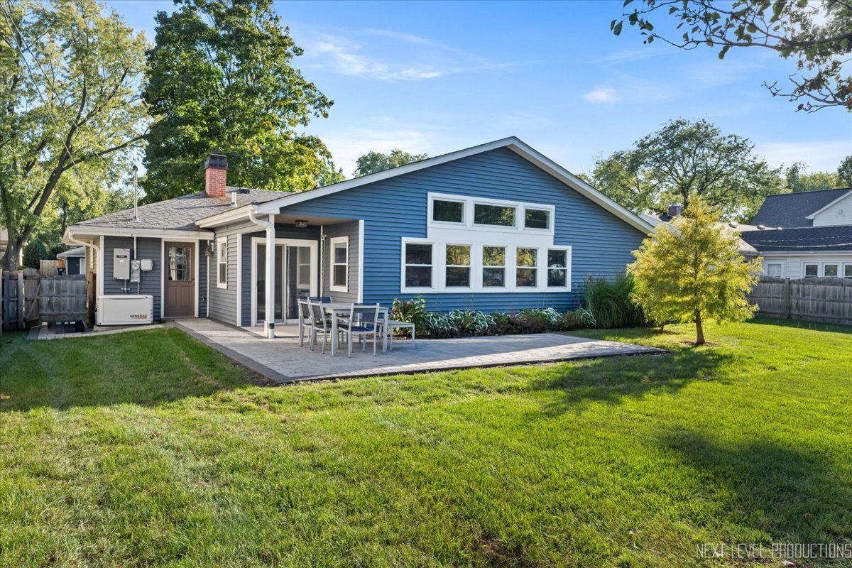 703 Wakeman Avenue Wheaton, IL 60187 - Photo 19 of 20 a front view of a house with yard and green space