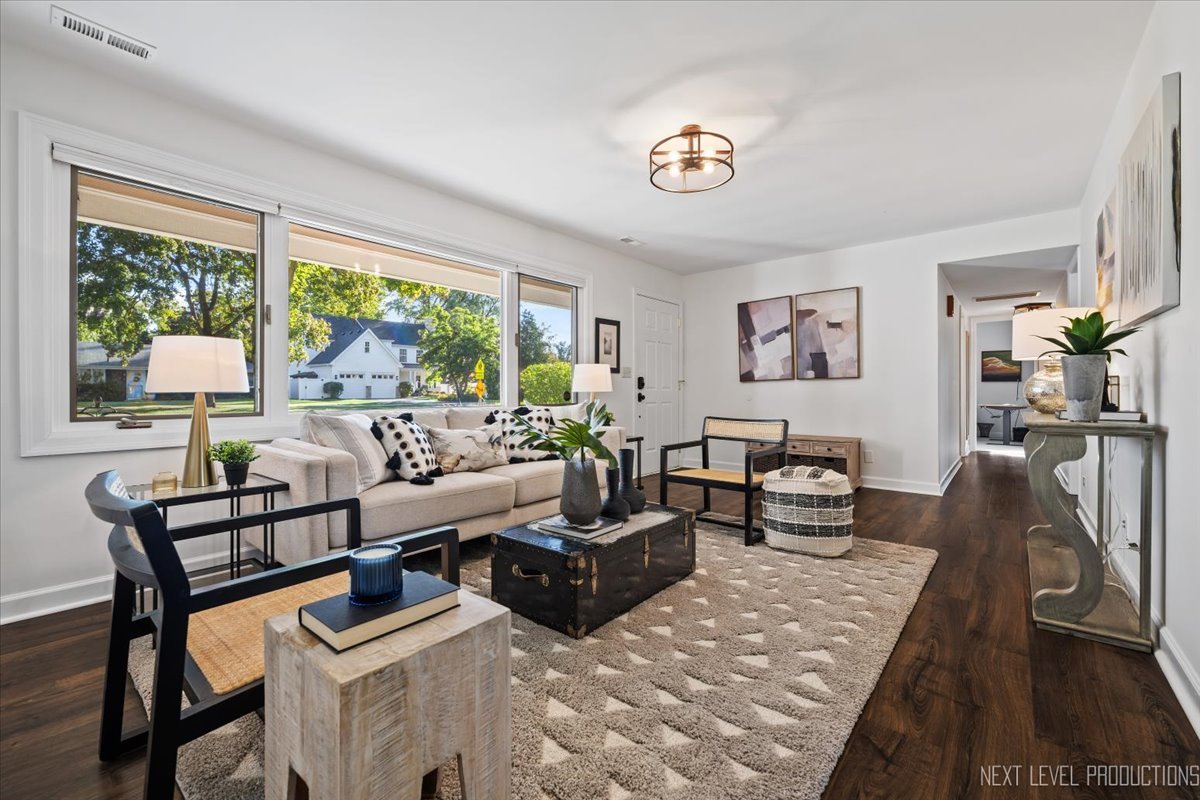 703 Wakeman Avenue Wheaton, IL 60187 - Photo 3 of 20 a living room with furniture and a large window