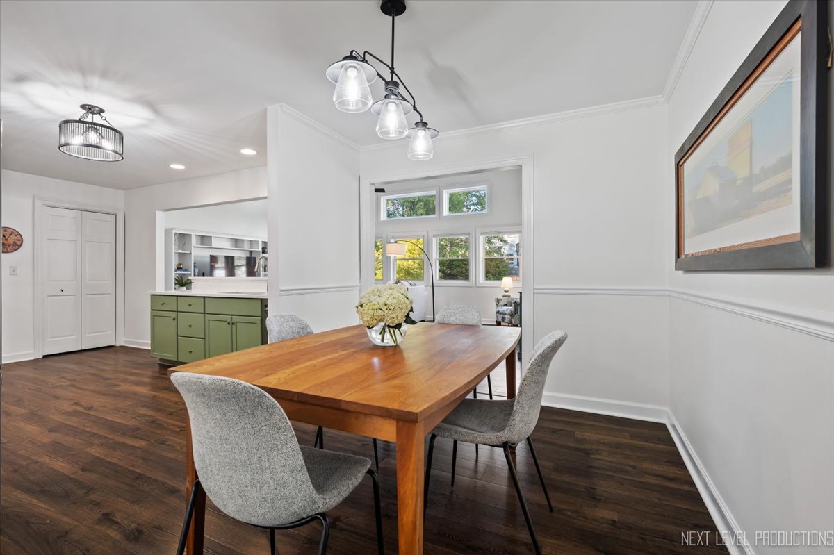 703 Wakeman Avenue Wheaton, IL 60187 - Photo 5 of 20 a view of a dining room with furniture and wooden floor