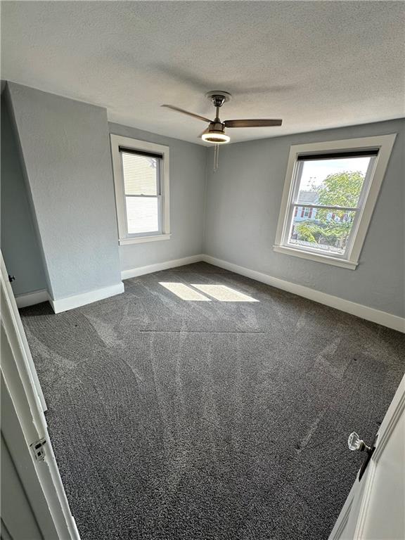 120 Rinne Street Pittsburgh, PA 15210 - Photo 6 of 29 a view of empty room with windows