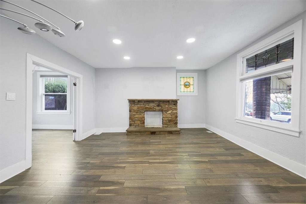 120 Rinne Street Pittsburgh, PA 15210 - Photo 9 of 29 a view of an empty room with a window and wooden floor