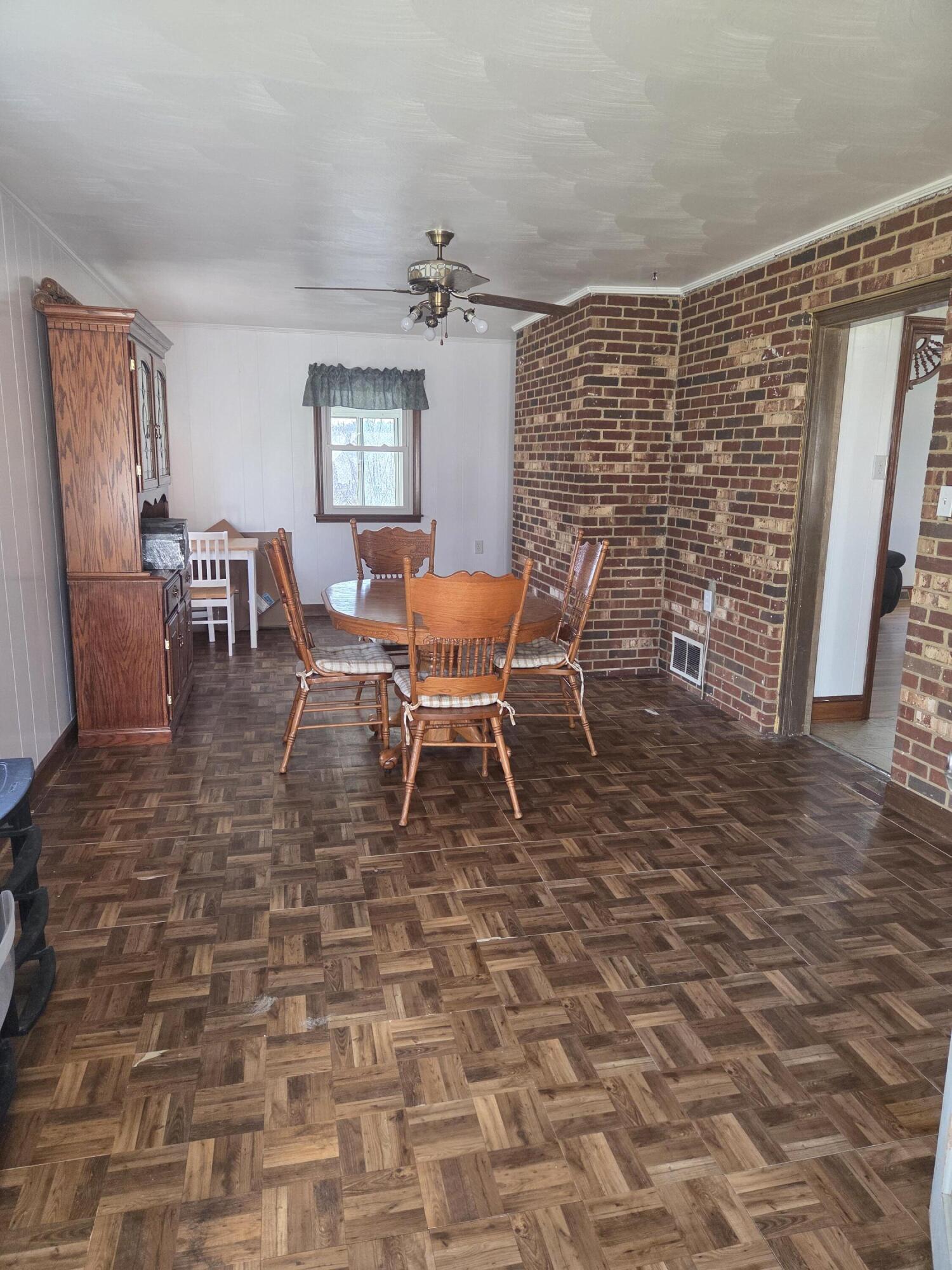 552 Antioch Road Rocky Mount, VA 24151 - Photo 2 of 11 a dining room with furniture and wooden floor