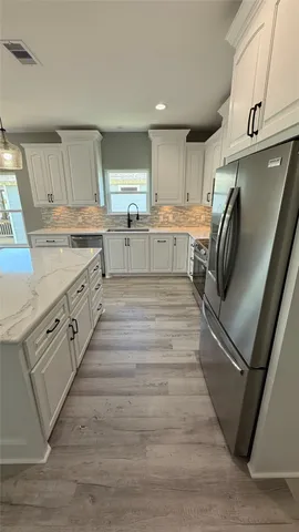 a front view of a house with wooden floor