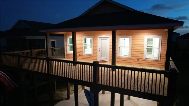 a kitchen with granite countertop a stove oven and wooden floor