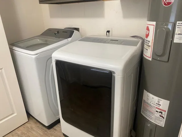 a utility room with dryer and washer