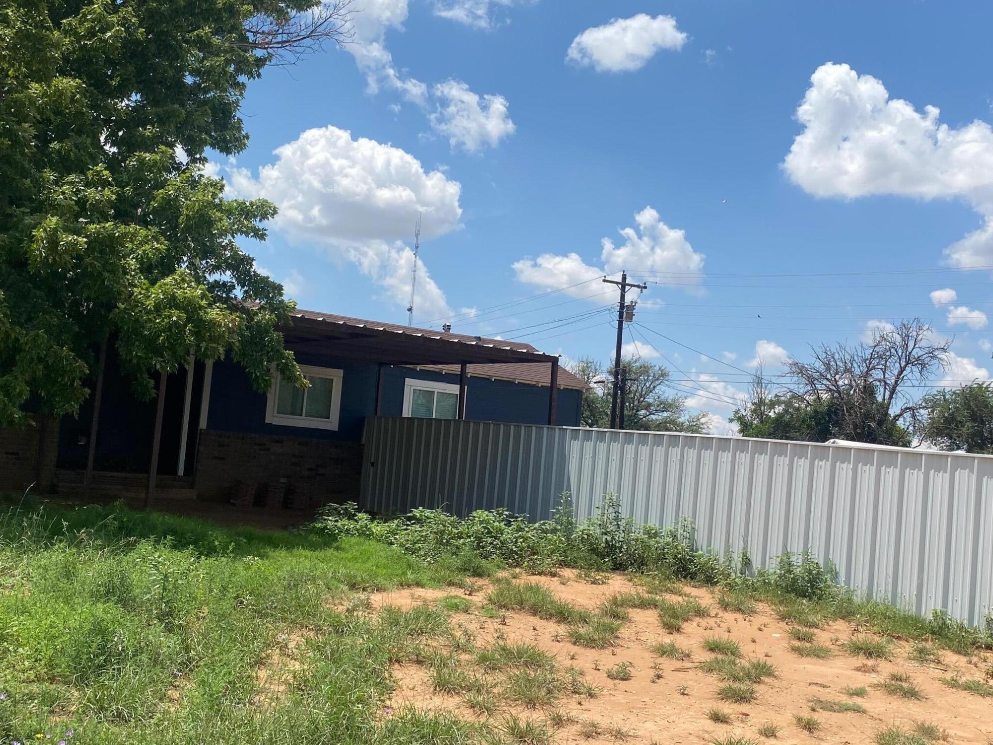 207 East 5th Street Sundown, TX 79372 - Photo 13 of 13 a view of a house with backyard and garden