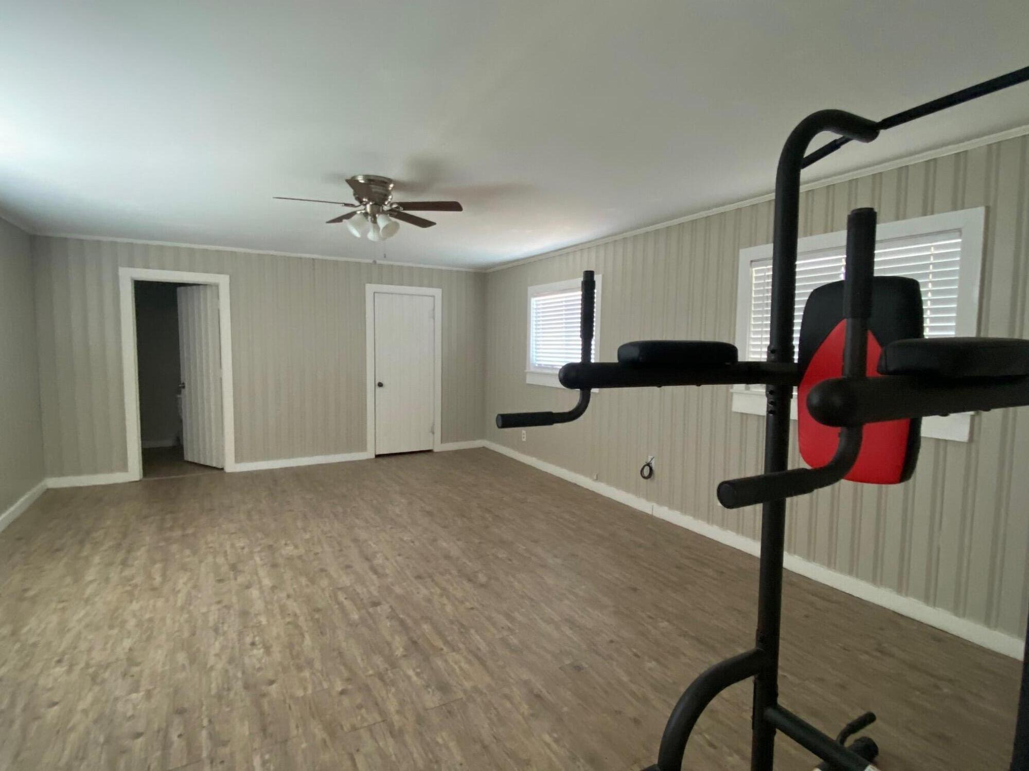 207 East 5th Street Sundown, TX 79372 - Photo 6 of 13 a very nice looking room with a ceiling fan