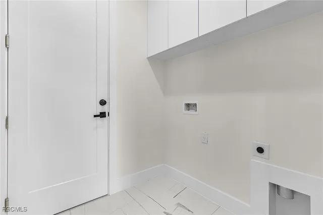 a kitchen with stainless steel appliances a sink a stove and a refrigerator