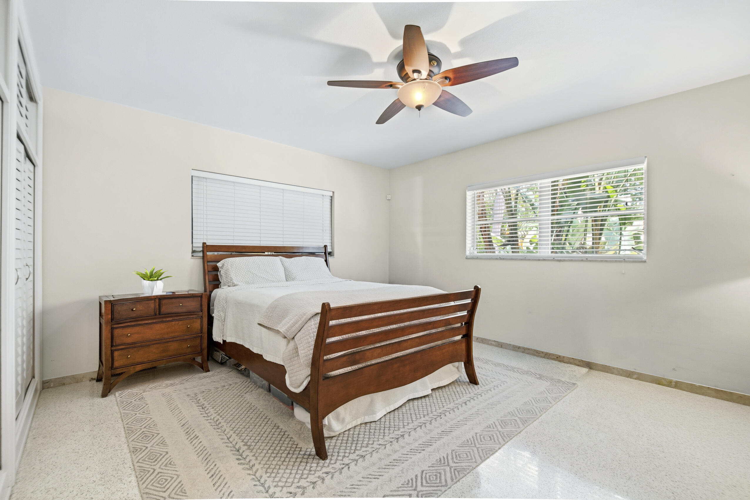 1348 Southwest 4th Street Boca Raton, FL 33486 - Photo 20 of 44 a bedroom with a bed and a chandelier