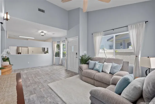 a living room with furniture and a large window