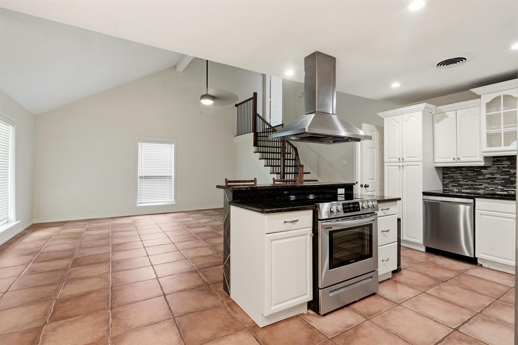 7354 Walling Lane Dallas, TX 75231 - Photo 9 of 28 a kitchen with a stove and a sink