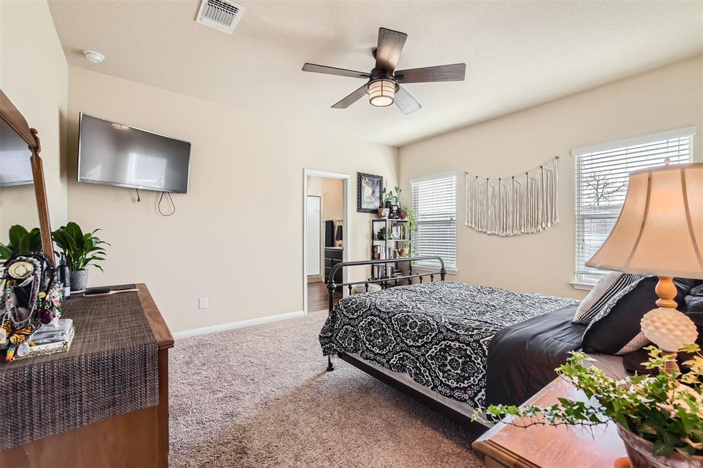 3013 Blantyre Bend Round Rock, TX 78664 - Photo 9 of 20 a bedroom with a bed dresser and mirror