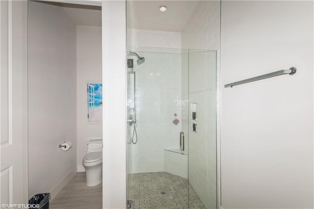 14605 Kingfisher Loop Naples, FL 34120 - Photo 22 of 42 a bathroom with a granite countertop sink