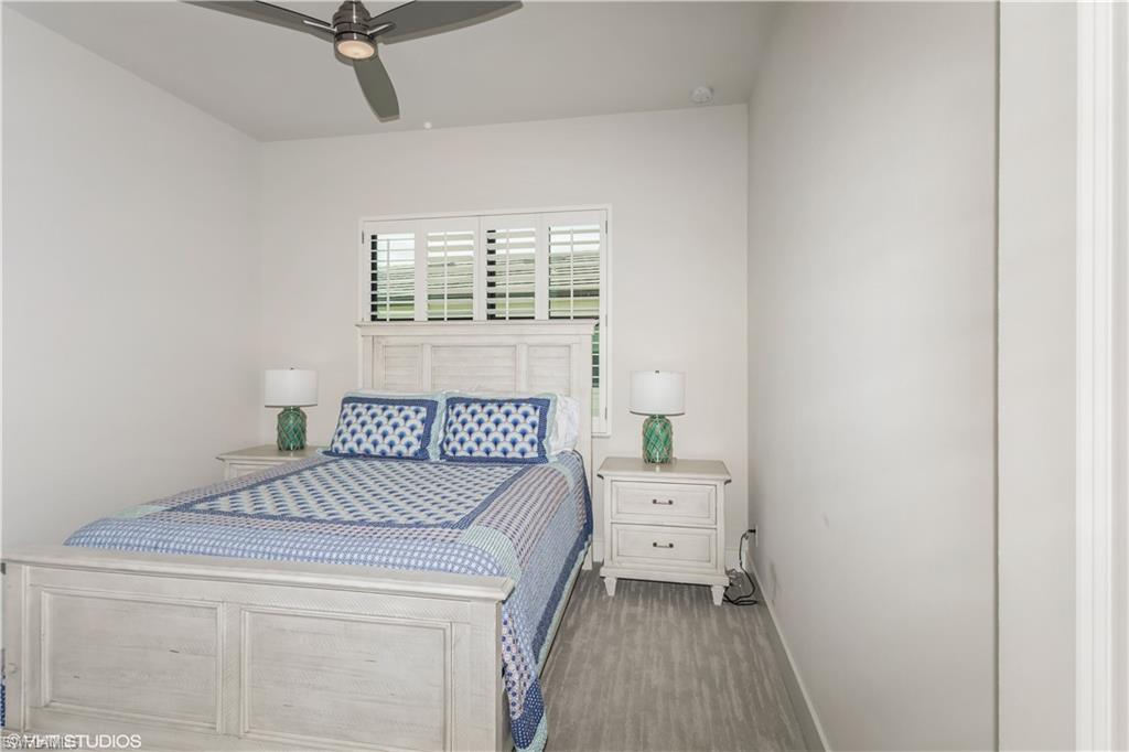 14605 Kingfisher Loop Naples, FL 34120 - Photo 24 of 42 a bedroom with a bed and a window