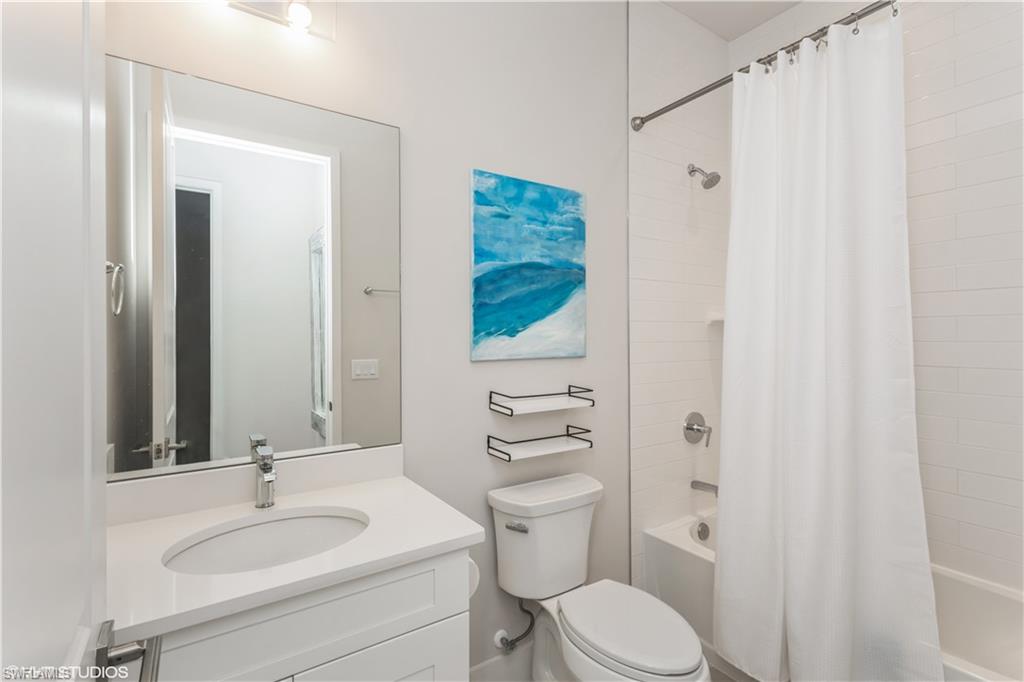 14605 Kingfisher Loop Naples, FL 34120 - Photo 27 of 42 a bathroom with a sink toilet and shower